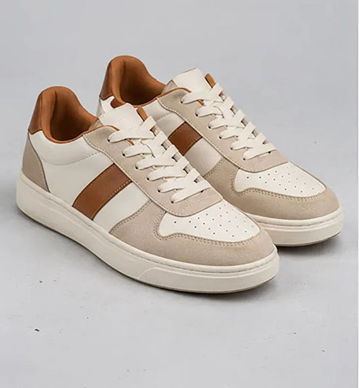 Beige sneakers on gray background for shoe clipping path